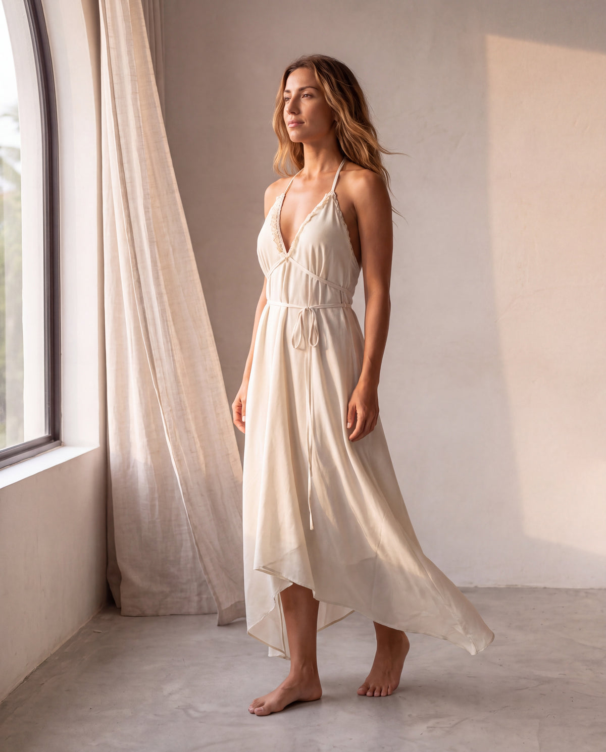 The Amalfi Dress in Cream, in movement