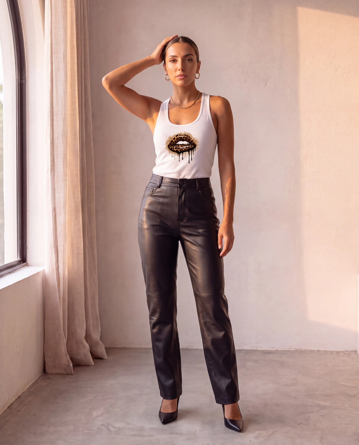 Wild Bite Racerback in white with leather trousers