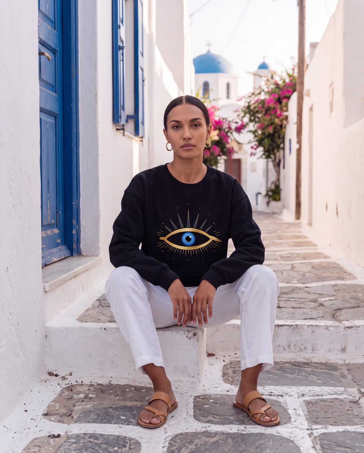 Mati Sweater in Black with gold evil eye chest print