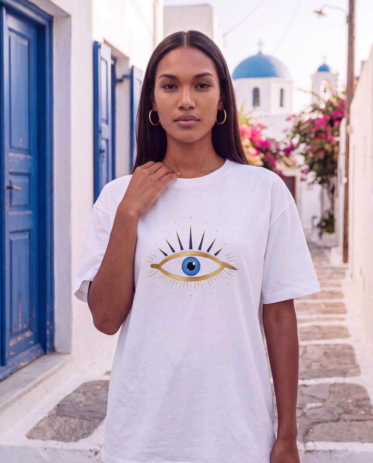 Mati Oversized Tee in White, close up of the gold evil eye print
