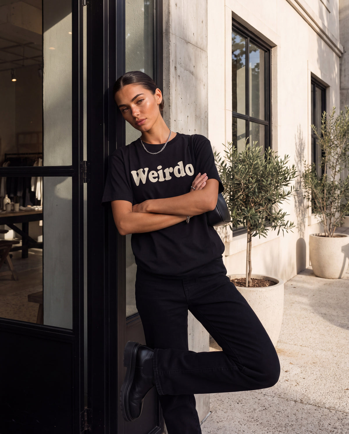 The Weirdo Tee in Black, on model