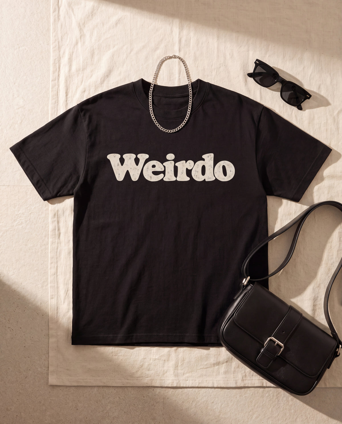 The Weirdo Tee in Black, flat lay