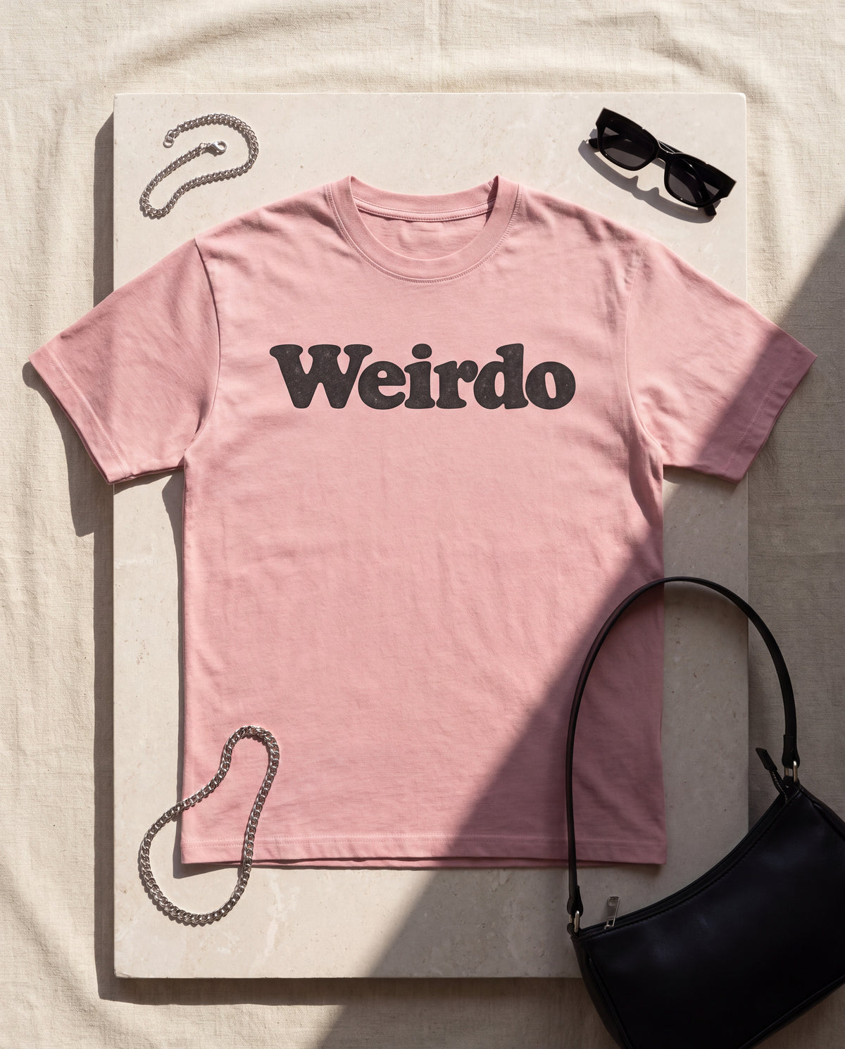 The Weirdo Tee in Pink, flat lay